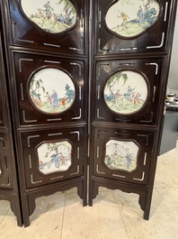 A Chinese four-fold wooden room divider with famille rose 'Romance of the Western Chamber' plaques, Republic