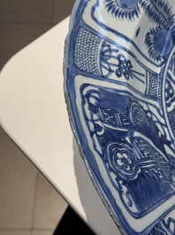 A large Chinese blue and white 'kraak' dish with birds among flowering branches, Wanli