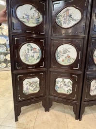 A Chinese four-fold wooden room divider with famille rose 'Romance of the Western Chamber' plaques, Republic