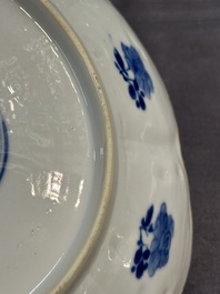 A pair of Chinese lotus-shaped blue and white plates with floral design, yu mark, Kangxi