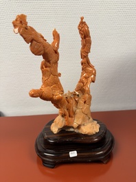 A Chinese red coral group of boys and bitter gourds on wooden stand, 19/20th C.