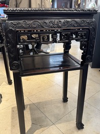 A pair of Chinese famille verte 'narrative' plaques mounted in hardwood tables, 19th C.