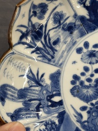 A pair of Chinese lotus-shaped blue and white plates with floral design, yu mark, Kangxi
