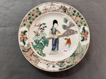 A Chinese famille verte 'lady and playing boy' plate, Kangxi