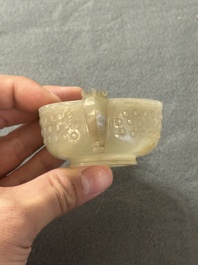 Two Chinese celadon jade censers, a snuff bottle and a two-handled cup, Ming and later