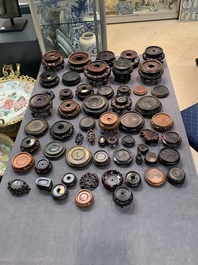 A large collection of 103 Chinese wooden stands, covers and other wood works, 19/20th C.