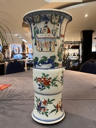A pair of Chinese wucai 'gu' vases with narrative design, Transitional period