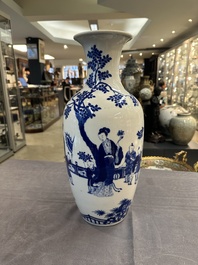 A Chinese blue and white vase with ladies and playing boys in a garden, 19th C.
