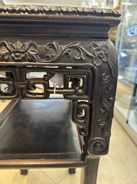 A pair of Chinese famille verte 'narrative' plaques mounted in hardwood tables, 19th C.