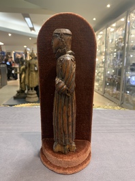 Two carved wooden Corpi Christi and a figure of a monk, Spain and Goa, 16th C.
