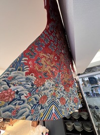 A fine Chinese gold thread embroidered red-ground silk noble lady&rsquo;s 'dragon' robe, 18/19th C.