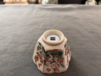 A fine Chinese famille verte 'boy and lotus' flower-shaped cup and a wooden stand, Kangxi