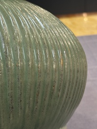 A Chinese Longquan celadon 'lotus' bowl and a large green-glazed jar, Ming and later