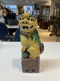 A pair of Chinese sancai-glazed rooftiles, a pair of Buddhist lions and a warrior, Ming and later