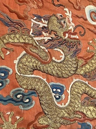 A fine Chinese gold thread embroidered red-ground silk noble lady&rsquo;s 'dragon' robe, 18/19th C.