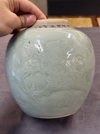 A Chinese celadon-glazed 'dragon' jar with reticulated wooden cover and stand, Qianlong