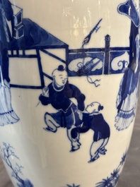 A Chinese blue and white vase with ladies and playing boys in a garden, 19th C.