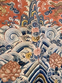 A fine Chinese gold thread embroidered red-ground silk noble lady&rsquo;s 'dragon' robe, 18/19th C.