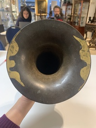 A Chinese archaistic bronze gold-splashed 'dragon' vase, Dong 東 mark, Ming