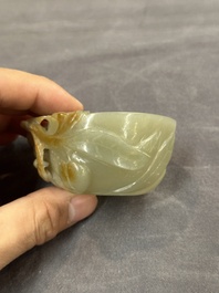 A Chinese jade peach-shaped brush washer on wooden stand, 19th C.