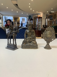 A Burmese gilt bronze Buddha, an Indian bronze Shiva on horseback and and a Nepalese Melong ritual mirror with Ganesh, 18/19th C.