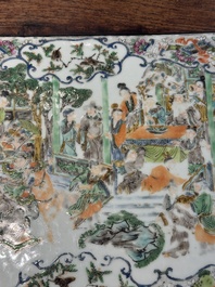 A pair of Chinese famille verte 'narrative' plaques mounted in hardwood tables, 19th C.