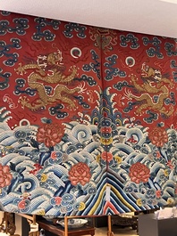 A fine Chinese gold thread embroidered red-ground silk noble lady&rsquo;s 'dragon' robe, 18/19th C.