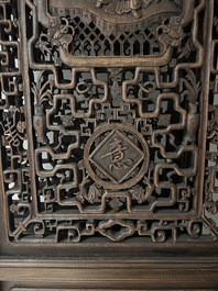Four Chinese carved and openworked wooden doors, early 20th C.
