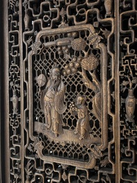 Four Chinese carved and openworked wooden doors, early 20th C.