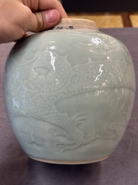 A Chinese celadon-glazed 'dragon' jar with reticulated wooden cover and stand, Qianlong