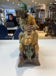 A pair of Chinese sancai-glazed rooftiles, a pair of Buddhist lions and a warrior, Ming and later