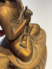 A fine Chinese gilt bronze Buddha, Qianlong mark and of the period