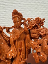 A Chinese red coral group of goddesses on wooden stand, 19/20th C.