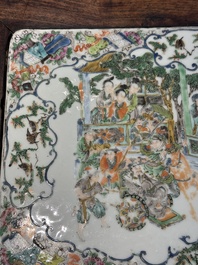 A pair of Chinese famille verte 'narrative' plaques mounted in hardwood tables, 19th C.
