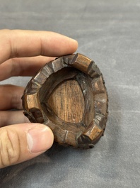 A Chinese jade peach-shaped brush washer on wooden stand, 19th C.