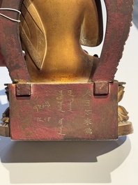 A fine Chinese gilt bronze Buddha, Qianlong mark and of the period