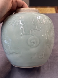 A Chinese celadon-glazed 'dragon' jar with reticulated wooden cover and stand, Qianlong