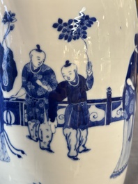 A Chinese blue and white vase with ladies and playing boys in a garden, 19th C.