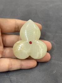 A Chinese Mughal-style leaf-shaped ruby-inset jade box and cover on wooden base, 18th C.