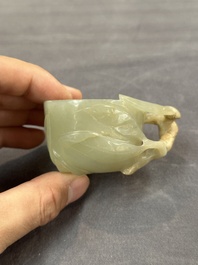 A Chinese jade peach-shaped brush washer on wooden stand, 19th C.