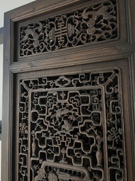 Four Chinese carved and openworked wooden doors, early 20th C.