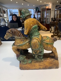 A pair of Chinese sancai-glazed rooftiles, a pair of Buddhist lions and a warrior, Ming and later
