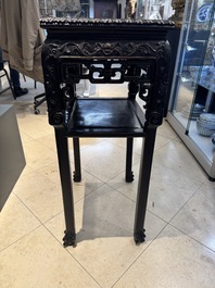A pair of Chinese famille verte 'narrative' plaques mounted in hardwood tables, 19th C.