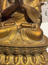 A fine Chinese gilt bronze Buddha, Qianlong mark and of the period