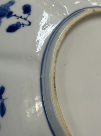 A pair of Chinese lotus-shaped blue and white plates with floral design, yu mark, Kangxi