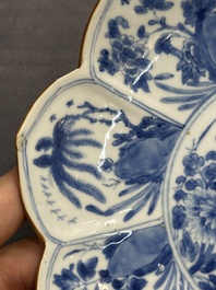 A pair of Chinese lotus-shaped blue and white plates with floral design, yu mark, Kangxi