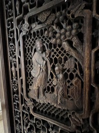 Four Chinese carved and openworked wooden doors, early 20th C.