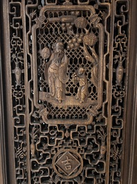 Four Chinese carved and openworked wooden doors, early 20th C.