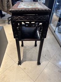 A pair of Chinese famille verte 'narrative' plaques mounted in hardwood tables, 19th C.