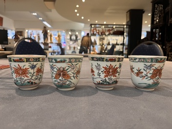 A set of 12 Chinese famille verte cups and saucers with floral design, Kangxi